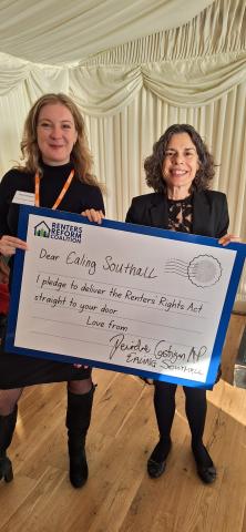 MP Deirdre Costigan and RRC Director Clara holding a postcard reading "Dear Ealing Southall, I pledge to deliver the Renters' Rights Act straight to your door. Love from Deirdre Costigan MP Ealing Southall"